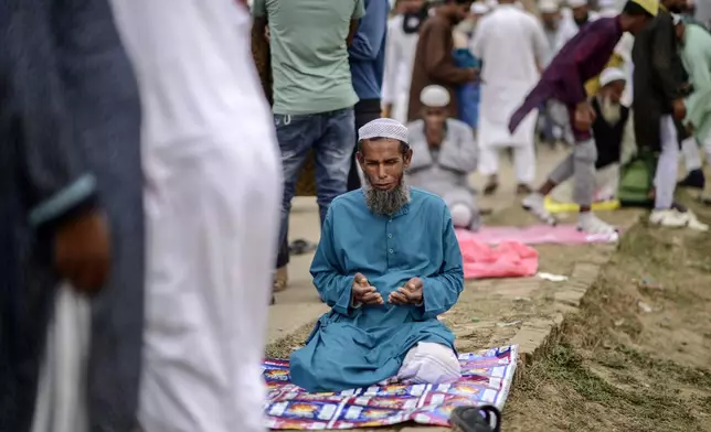 A Muslim devotee prays during the first phase of the three-day Biswa Ijtema, or the World Congregation of Muslims, at the banks of the Turag river in Tongi, near Dhaka, Bangladesh, Friday, Jan. 31, 2025. (AP Photo/Mahmud Hossain Opu)