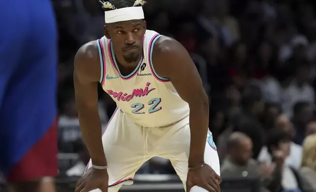 Miami Heat forward Jimmy Butler (22) stands on the court during the first half of an NBA basketball game against the Denver Nuggets, Friday, Jan. 17, 2025, in Miami. (AP Photo/Lynne Sladky)