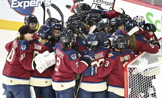 Montreal Victoire players celebrate after defeating the Toronto Sceptres in a PWHL hockey game in Laval, Que., Thursday, January 30, 2025. (Graham Hughes/The Canadian Press via AP)
