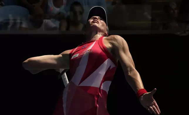Elena Rybakina of Kazakhstan serves to Madison Keys of the U.S. during their fourth round match at the Australian Open tennis championship in Melbourne, Australia, Monday, Jan. 20, 2025. (AP Photo/Manish Swarup)