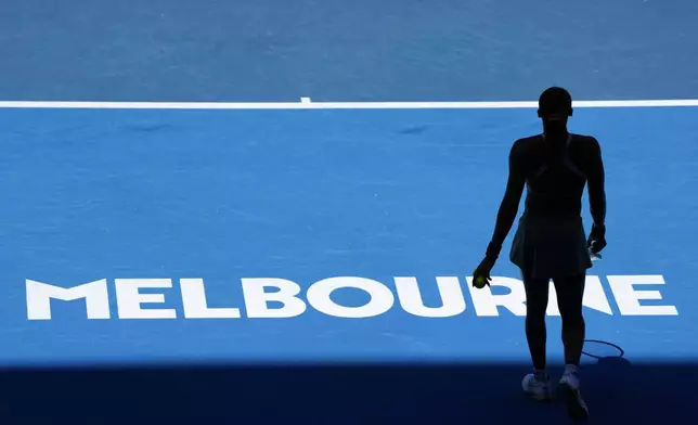 Coco Gauff of the U.S. prepares to serve to Paula Badosa of Spain during their quarterfinal match at the Australian Open tennis championship in Melbourne, Australia, Tuesday, Jan. 21, 2025. (AP Photo/Vincent Thian)
