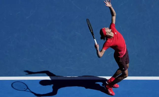 Alexander Zverev of Germany serves to Jacob Fearnley of Britain during their third round match at the Australian Open tennis championship in Melbourne, Australia, Friday, Jan. 17, 2025. (AP Photo/Vincent Thian)