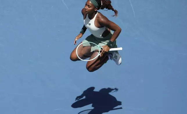Coco Gauff of the U.S. warms up before a fourth round match against Belinda Bencic of Switzerland at the Australian Open tennis championship in Melbourne, Australia, Sunday, Jan. 19, 2025. (AP Photo/Mark Baker)