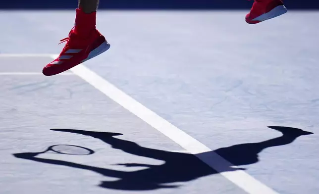 Alexander Zverev of Germany serves to Tommy Paul of the U.S. during their quarterfinal match at the Australian Open tennis championship in Melbourne, Australia, Tuesday, Jan. 21, 2025. (AP Photo/Vincent Thian)