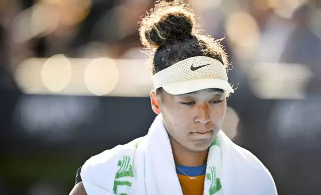 Naomi Osaka of Japan leaves the court after forfeiting her match against Clara Tauson of Denmark in the finals singles match of the ASB Classic tennis tournament at Manuka Doctor Arena in Auckland, New Zealand, Sunday, Jan. 5, 2025. (Alan Lee/Photosport via AP)