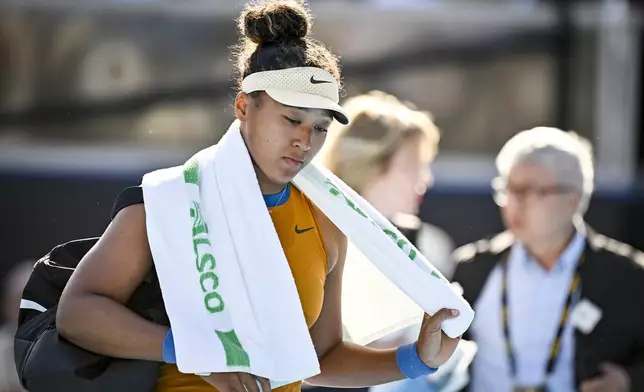 Naomi Osaka of Japan reacts after forfeiting her match against Clara Tauson of Denmark in the finals singles match of the ASB Classic tennis tournament at Manuka Doctor Arena in Auckland, New Zealand, Sunday, Jan. 5, 2025. (Alan Lee/Photosport via AP)