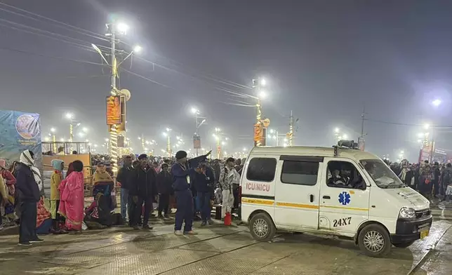 An ambulance leaves the site of a stampede at the Sangam, the confluence of the Ganges, the Yamuna and the mythical Saraswati rivers, on Mauni Amavasya' or new moon day during the Maha Kumbh festival, in Prayagraj, Uttar Pradesh, India, Wednesday, Jan. 29, 2025. (AP Photo/Rajesh Kumar Singh)