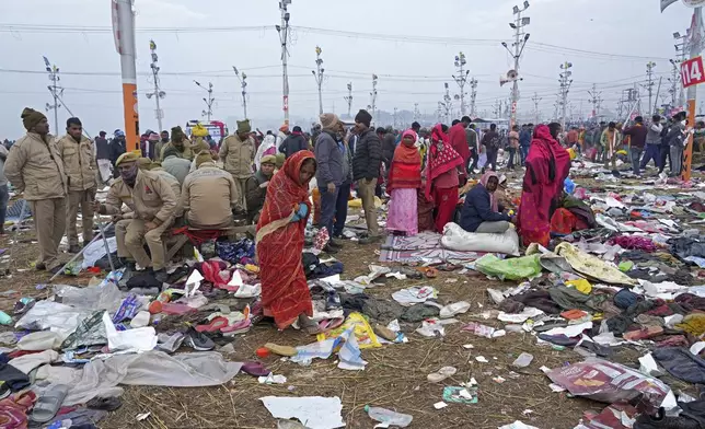 Hindu devotees search for their belongings after a stampede when Hindu devotees rushed to take a holy bath in the Sangam, the confluence of the Ganges, the Yamuna and the mythical Saraswati rivers, on "Mauni Amavasya" or new moon day during the Maha Kumbh festival in Prayagraj, India, Wednesday, Jan. 29, 2025. (AP Photo/Deepak Sharma)