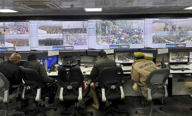Police officials monitor the movement of people at the control room after a stampede when Hindu devotees rushed to take a holy bath in the Sangam, the confluence of the Ganges, the Yamuna and the mythical Saraswati rivers, on "Mauni Amavasya" or new moon day during the Maha Kumbh festival in Prayagraj, India, Wednesday, Jan. 29, 2025. (AP Photo/Rajesh Kumar Singh)