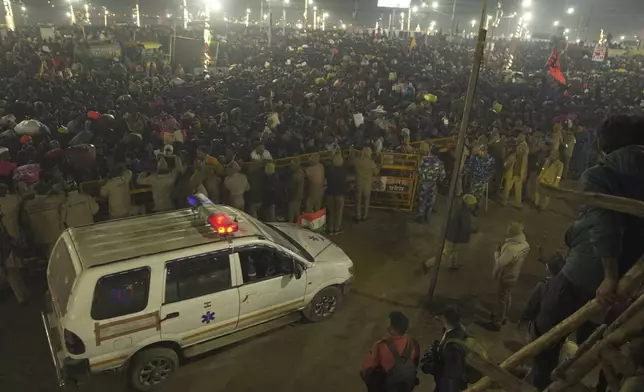 An ambulance arrives by the site of a stampede on the Sangam, the confluence of the Ganges, the Yamuna and the mythical Saraswati rivers, on "Mauni Amavasya" or new moon day during the Maha Kumbh festival, in Prayagraj, Uttar Pradesh, India, Wednesday, Jan. 29, 2025. (AP Photo)