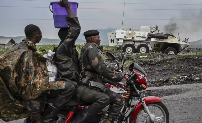 CAPTION CORRECTS YEAR A UN armoured personnel carrier burns during clashes with M23 rebels outside Goma, Democratic Republic of the Congo, Saturday, Jan. 25, 2025. (AP Photo/Moses Sawasawa)