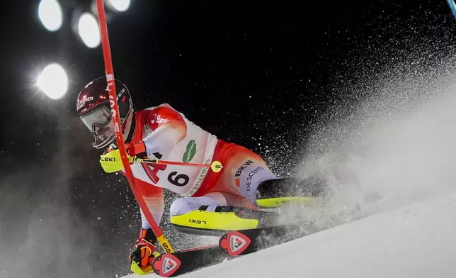 Switzerland's Loic Meillard competes during an alpine ski, men's World Cup slalom, in Schladming, Austria, Wednesday, Jan. 29, 2025. (AP Photo/Giovanni Auletta)