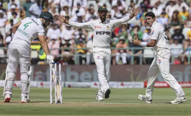 South Africa's Aiden Markram looks on as Pakistan's Shan Masood and Mohammad Abbas appeal for LBW off the first ball during the second test match between South Africa and Pakistan in Cape Town, South Africa, Friday, Jan. 3, 2025. (AP Photo/Halden Krog)