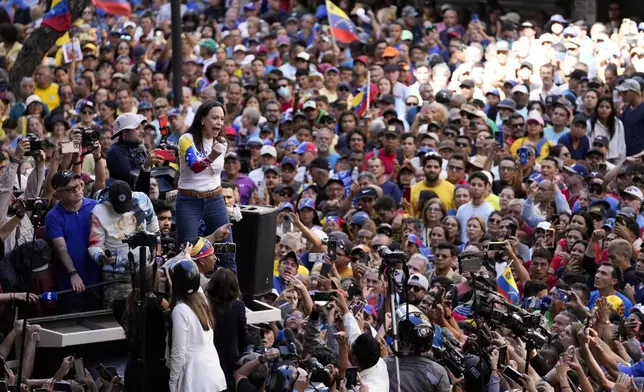 Opposition leader Maria Corina Machado addresses supporters during a protest against Venezuelan President Nicolas Maduro the day before his inauguration for a third term in Caracas, Venezuela, Thursday, Jan. 9, 2025. (AP Photo/Matias Delacroix)