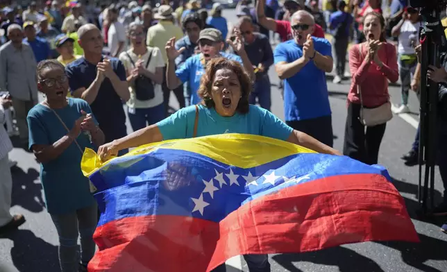 Opponents of Venezuelan President Nicolas Maduro protest the day before his inauguration for a third term in Caracas, Venezuela, Thursday, Jan. 9, 2025. (AP Photo/Matias Delacroix)