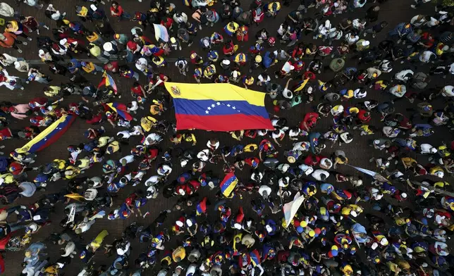 Opponents of Venezuelan President Nicolas Maduro protest the day before his inauguration for a third term in Bogota, Colombia, Thursday, Jan. 9, 2025. (AP Photo/Ivan Valencia)