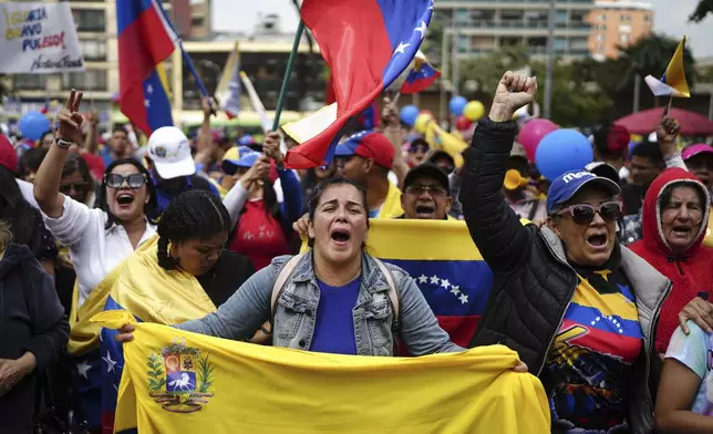 Opponents of Venezuelan President Nicolas Maduro protest the day before his inauguration for a third term in Bogota, Colombia, Thursday, Jan. 9, 2025. (AP Photo/Ivan Valencia)