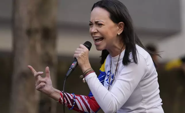 Opposition leader Maria Corina Machado addresses supporters during a protest against President Nicolas Maduro the day before his inauguration for a third term in Caracas, Venezuela, Thursday, Jan. 9, 2025. (AP Photo/Matias Delacroix)