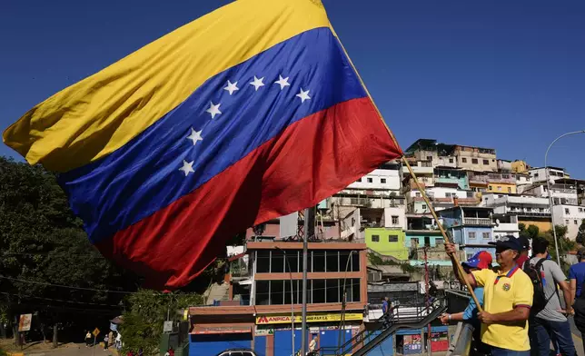 Opponents of Venezuelan President Nicolas Maduro demonstrate the day before his inauguration for a third term in Caracas, Venezuela, Thursday, Jan. 9, 2025. (AP Photo/Ariana Cubillos)