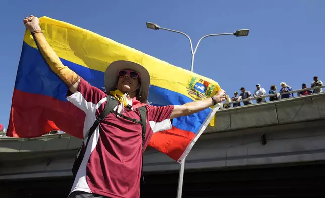 Opponents of Venezuelan President Nicolas Maduro protest the day before his inauguration for a third term in Caracas, Venezuela, Thursday, Jan. 9, 2025. (AP Photo/Ariana Cubillos)