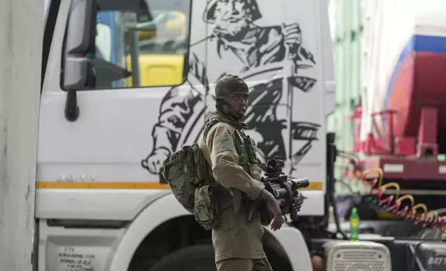 M23 rebels' patrol Gisenyi border point, Congo, Wednesday, Jan. 29, 2025, after they advanced into eastern Congo's capital Goma. (AP Photo/Brian Inganga)