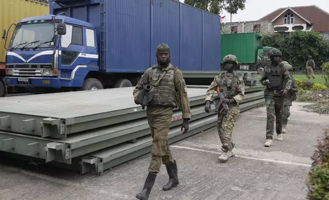 M23 rebels' patrol Gisenyi border point, Congo, Wednesday, Jan. 29, 2025, after they advanced into eastern Congo's capital Goma. (AP Photo/Brian Inganga)