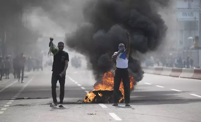 People protest in Kinshasa, Democratic Republic of the Congo Tuesday, Jan. 28, 2025, against the Rwanda-backed M23 rebels' advances into eastern Congos capital Goma.(AP Photo/Samy Ntumba Shambuyi)