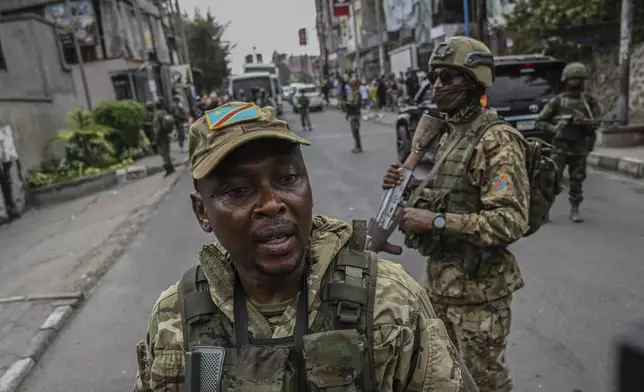M23 rebels escort Romanian mercenaries to the border crossing into Rwanda in Goma, Democratic Republic of Congo, Wednesday, Jan. 29, 2025.(AP Photo/Moses Sawasawa)
