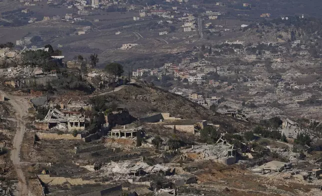 FILE - Destroyed buildings in an area of the village of Odaisseh in southern Lebanon, located next to the Israeli-Lebanese border, as seen from northern Israel, Dec. 5, 2024. (AP Photo/Matias Delacroix, File)