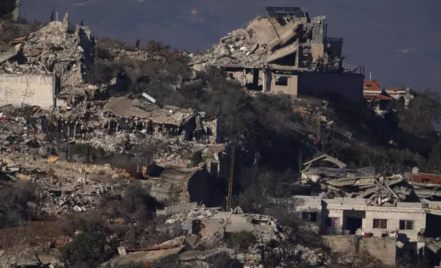 FILE - Destroyed buildings in an area of the village of Odaisseh in southern Lebanon, located next to the Israeli-Lebanese border, as seen from northern Israel, Dec. 1, 2024. (AP Photo/Leo Correa, File)