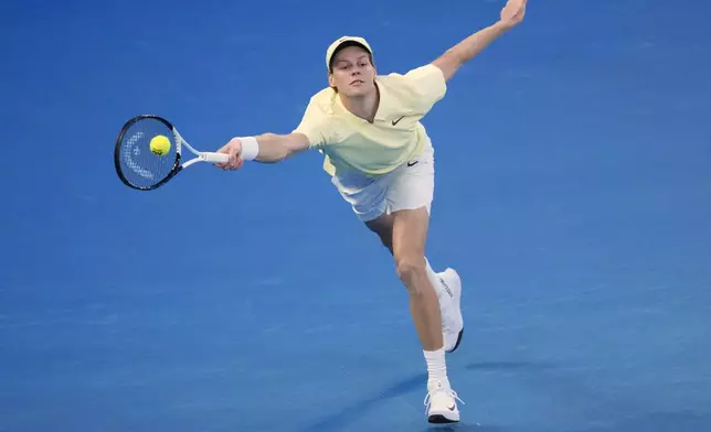 Jannik Sinner of Italy plays a forehand to Alexander Zverev of Germany during the men's singles final at the Australian Open tennis championship in Melbourne, Australia, Sunday, Jan. 26, 2025. (AP Photo/Vincent Thian)