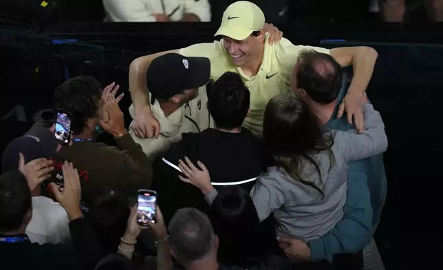 Jannik Sinner of Italy celebrates after defeating Alexander Zverev of Germany in the men's singles final at the Australian Open tennis championship in Melbourne, Australia, Sunday, Jan. 26, 2025. (AP Photo/Manish Swarup)