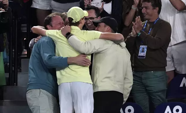 Jannik Sinner of Italy celebrates with supporters after defeating Alexander Zverev of Germany in the men's singles final at the Australian Open tennis championship in Melbourne, Australia, Sunday, Jan. 26, 2025. (AP Photo/Ng Han Guan)
