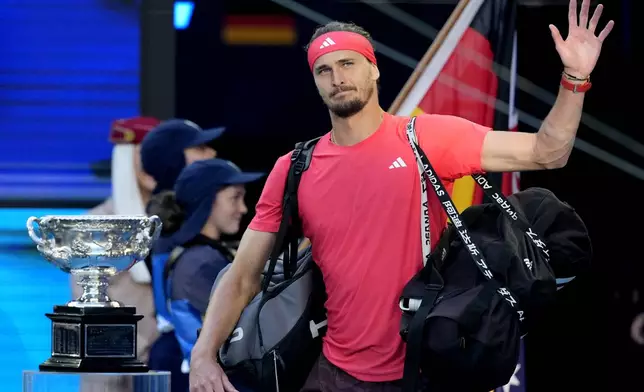Alexander Zverev of Germany waves as walks onto Rod Laver Arena for the men's singles final against Jannik Sinner of Italy at the Australian Open tennis championship in Melbourne, Australia, Sunday, Jan. 26, 2025. (AP Photo/Asanka Brendon Ratnayake)