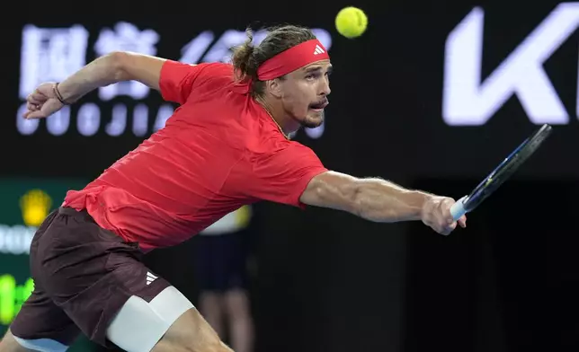 Alexander Zverev of Germany plays a backhand return to Jannik Sinner of Italy during the men's singles final at the Australian Open tennis championship in Melbourne, Australia, Sunday, Jan. 26, 2025. (AP Photo/Asanka Brendon Ratnayake)