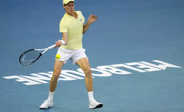 Jannik Sinner of Italy plays a forehand to Alexander Zverev of Germany during the men's singles final at the Australian Open tennis championship in Melbourne, Australia, Sunday, Jan. 26, 2025. (AP Photo/Vincent Thian)