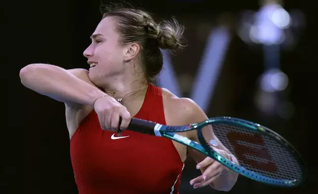 FILE - Aryna Sabalenka of Belarus plays a forehand return to Zheng Qinwen of China during the women's singles final at the Australian Open tennis championships at Melbourne Park, Melbourne, Australia, Saturday, Jan. 27, 2024. (AP Photo/Andy Wong, File)