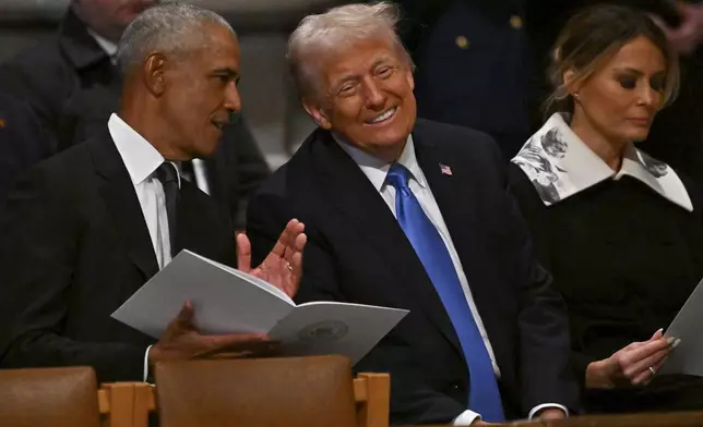 Former President Barack Obama, from left, speaks with President-elect Donald Trump as his wife Melania Trump looks on before the casket of former President Jimmy Carter arrives for a state funeral at the National Cathedral, Thursday, Jan. 9, 2025, in Washington. (Ricky Carioti/The Washington Post via AP, Pool)