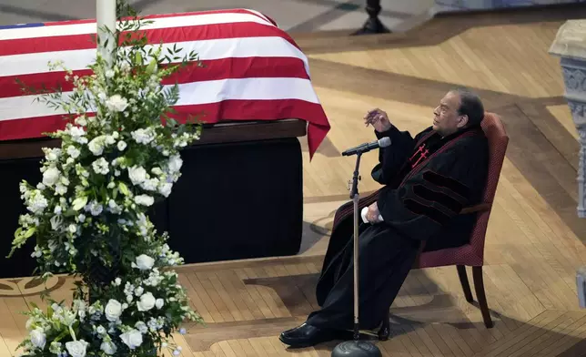 The Honorable Andrew Young speaks a Homily next to the flag-draped casket of former President Jimmy Carter, during a state funeral at Washington National Cathedral, Thursday, Jan. 9, 2025, in Washington. (AP Photo/Ben Curtis)