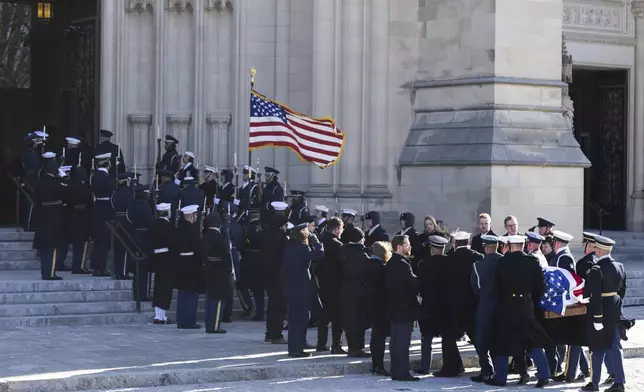 The flag-draped casket of former President Jimmy Carter arrives at the National Cathedral for a state funeral, Thursday, Jan. 9, 2025, in Washington. (Saul Loeb/Pool via AP)