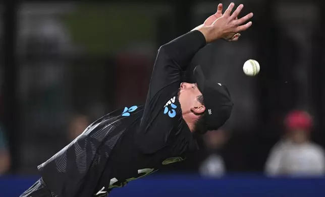 New Zealand's Will Young attempts to take a catch against Sri Lanka during their one day international cricket match in Hamilton, New Zealand. Wednesday, Jan. 8, 2025. (Andrew Cornaga/Photosport via AP)