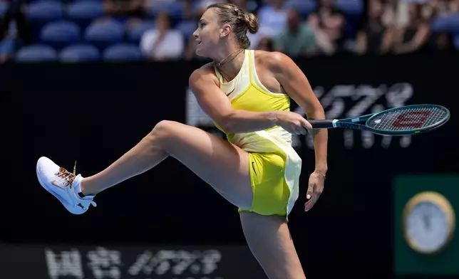 Aryna Sabalenka of Belarus plays a forehand return to Clara Tauson of Denmark during their third round match at the Australian Open tennis championship in Melbourne, Australia, Friday, Jan. 17, 2025. (AP Photo/Asanka Brendon Ratnayake)