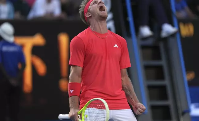 Alejandro Davidovich Fokina of Spain celebrates aftre defeating Jakub Mensik of the Czech Republic in their third round match at the Australian Open tennis championship in Melbourne, Australia, Friday, Jan. 17, 2025. (AP Photo/Ng Han Guan)