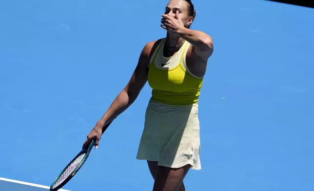 Aryna Sabalenka of Belarus celebrates after defeating Clara Tauson of Denmark in their third round match at the Australian Open tennis championship in Melbourne, Australia, Friday, Jan. 17, 2025. (AP Photo/Asanka Brendon Ratnayake)