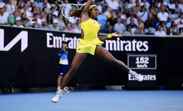 Coco Gauff of the U.S. plays a forehand return to Leylah Fernandez of Canada during their third round match at the Australian Open tennis championship in Melbourne, Australia, Friday, Jan. 17, 2025. (AP Photo/Vincent Thian)