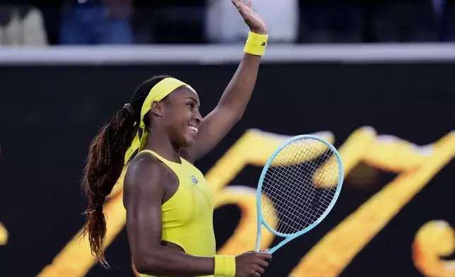 Coco Gauff of the U.S. waves after defeating Leylah Fernandez of Canada in their third round match at the Australian Open tennis championship in Melbourne, Australia, Friday, Jan. 17, 2025. (AP Photo/Vincent Thian)