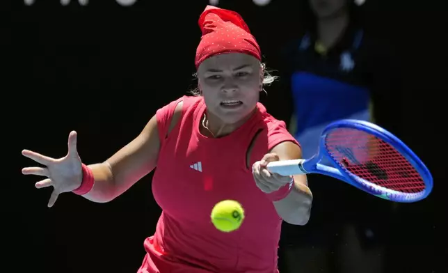 Diana Shnaider of Russia plays a forehand return to Donna Vekic of Croatia during their third round match at the Australian Open tennis championship in Melbourne, Australia, Friday, Jan. 17, 2025. (AP Photo/Vincent Thian)