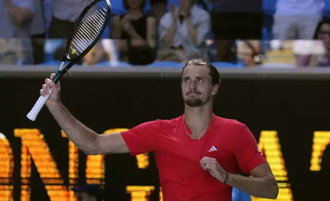 Alexander Zverev of Germany waves after defeating Jacob Fearnley of Britain in their third round match at the Australian Open tennis championship in Melbourne, Australia, Friday, Jan. 17, 2025. (AP Photo/Vincent Thian)