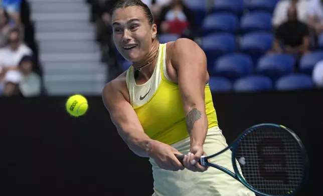 Aryna Sabalenka of Belarus plays a backhand return to Clara Tauson of Denmark during their third round match at the Australian Open tennis championship in Melbourne, Australia, Friday, Jan. 17, 2025. (AP Photo/Asanka Brendon Ratnayake)