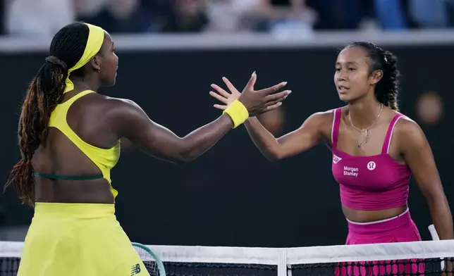 Coco Gauff, left, of the U.S. is congratulated by Leylah Fernandez of Canada following their third round match at the Australian Open tennis championship in Melbourne, Australia, Friday, Jan. 17, 2025. (AP Photo/Vincent Thian)
